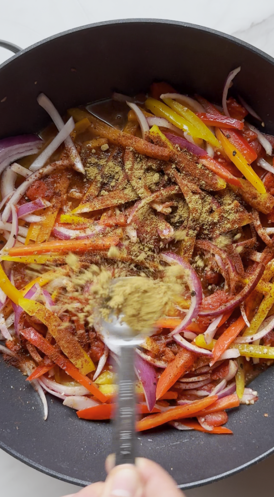 seasonings going into the chicken fajita pasta